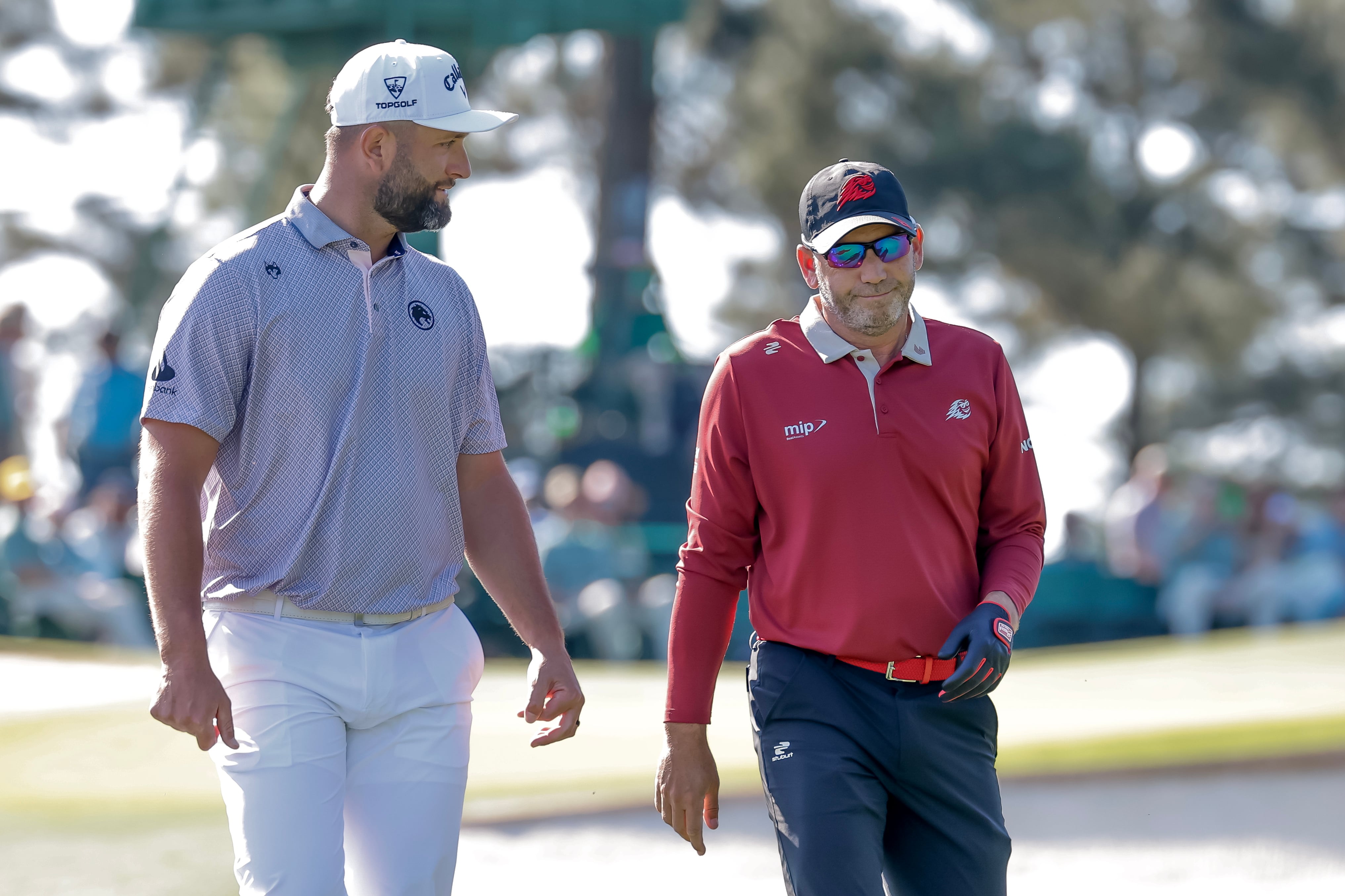 AUGUSTA (United States), 12/04/2026.- Jon Rahm (L) and Sergio Garcia (R) of Spain walk off the tee on the third hole during the final round of the 2026 Masters Tournament at the Augusta National Golf Club in Augusta, Georgia, USA, 12 April 2026. (España) EFE/EPA/ERIK S. LESSER