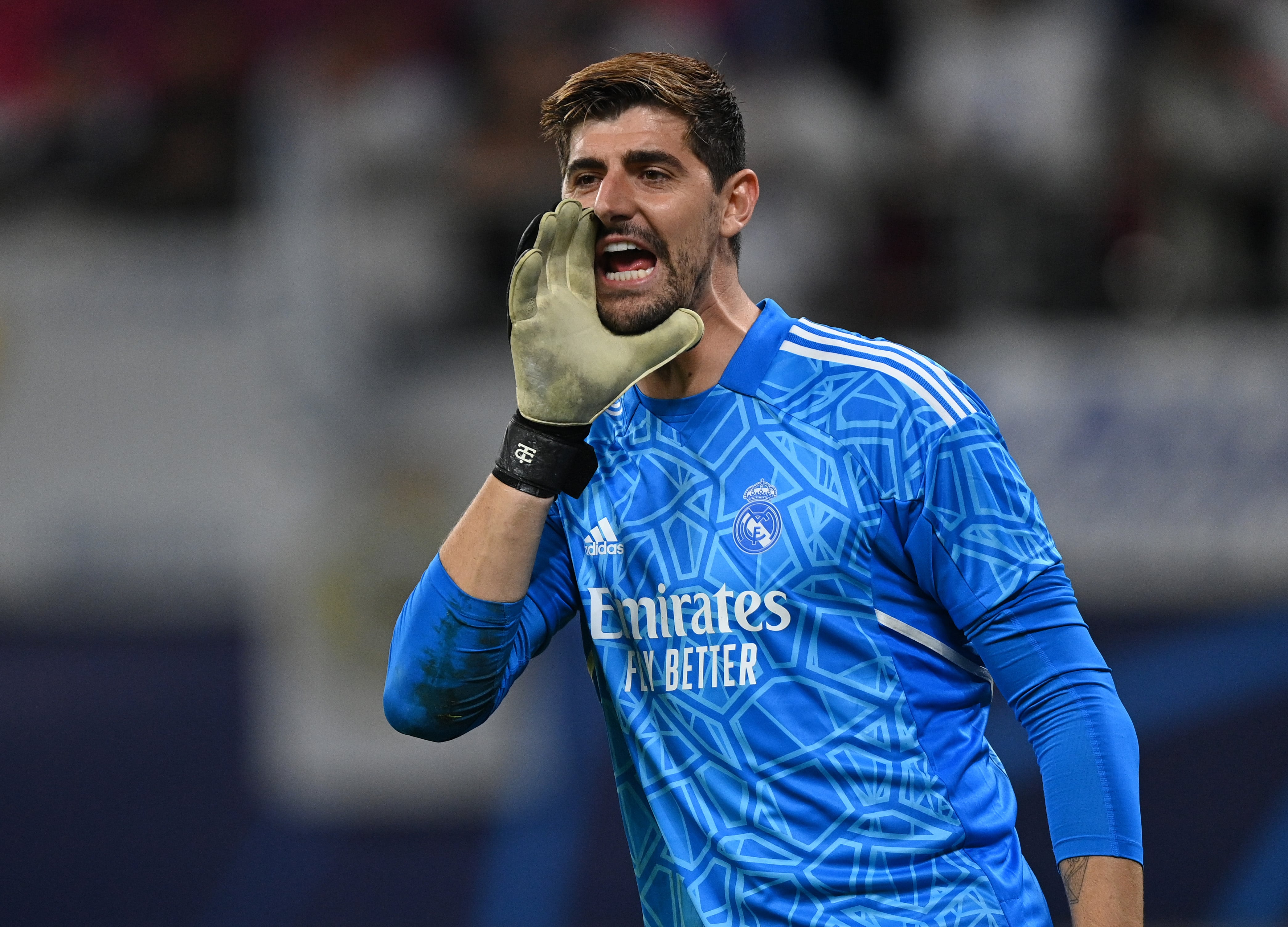 LEIPZIG, GERMANY - OCTOBER 25: Thibaut Courtois of Madrid shouts during the UEFA Champions League group F match between RB Leipzig and Real Madrid at Red Bull Arena on October 25, 2022 in Leipzig, Germany. (Photo by Stuart Franklin/Getty Images)