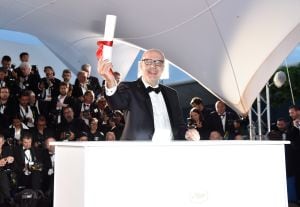 CANNES, FRANCE - MAY 22: Spanish director Juanjo Gimenez poses with the Palme d&#039;Or award for Best Short Film for &#039;Timecode&#039; at the Palme D&#039;Or Winner Photocall during the 69th annual Cannes Film Festival at the Palais des Festivals on May 22, 2016 in Canne