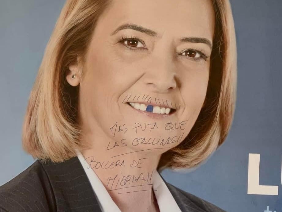 Pintada del cartel electoral de la candidata del PP de Motril, Luisa García Chamorro