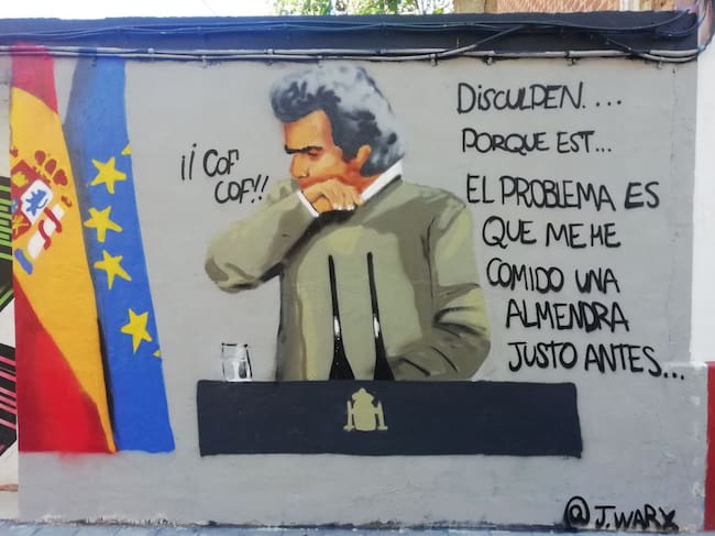 Grafiti del momento en el que el director del Centro de Coordinación de Emergencias de Sanidad, Fernando Simón, tose por 'comerse una almendra', en la calle Juan Giner de Benimaclet (València), firmado por @j.warx en Instagram