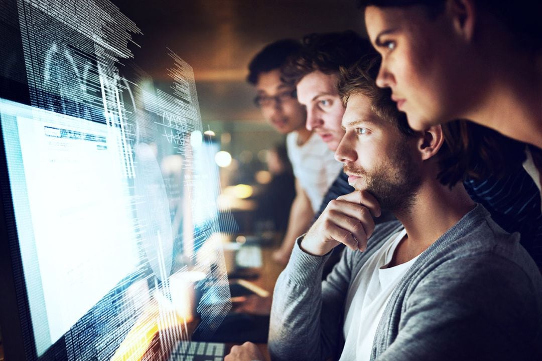 Foto de archivo de trabajadores de empresa tecnológica, que muestra T-System en su sitio web