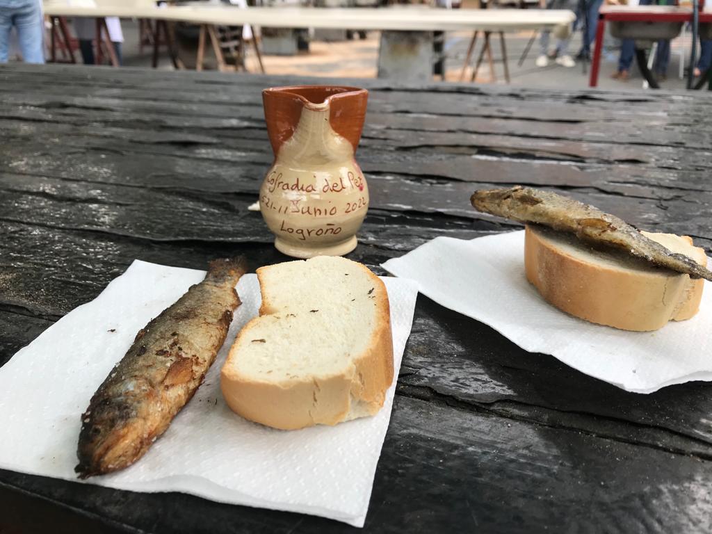 Reparto del pez, el pan y el vino