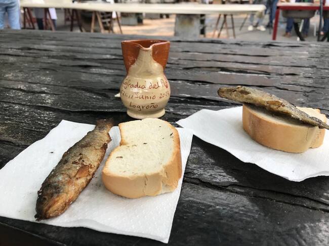 Reparto del pez, el pan y el vino