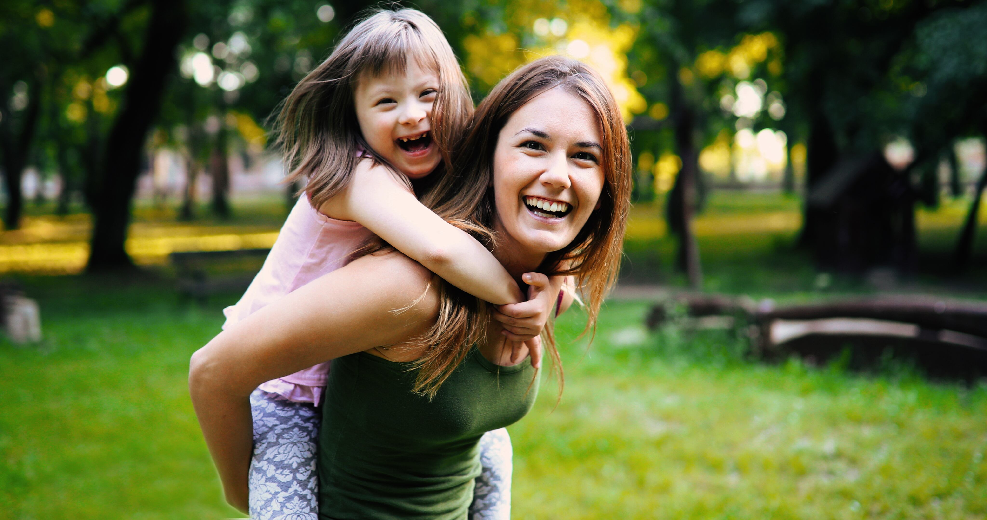 Little girl with special needs enjoy spending time with mother in nature