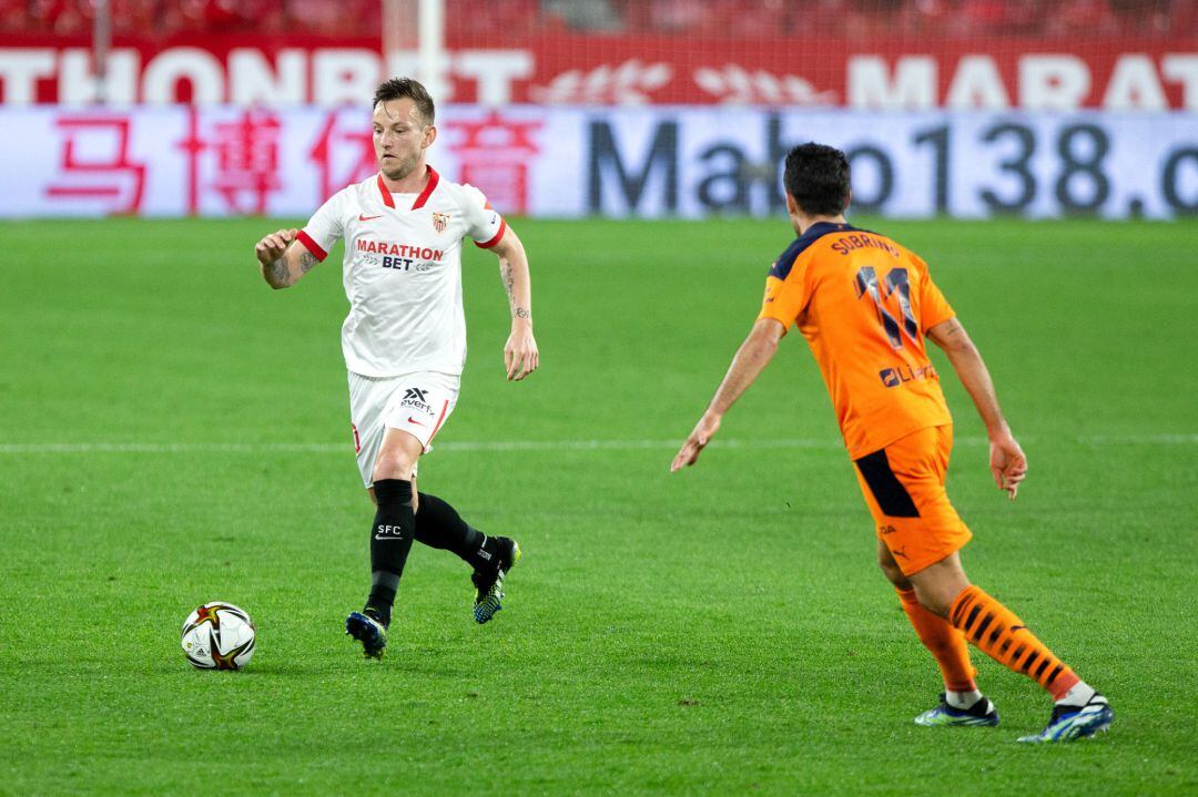 Ivan Rakitic of Sevilla and Ruben Sobrino of Valencia during 1-8 round of Copa del Rey, football match played between Sevilla Futbol Club and Valencia Club de Futbol at Ramon Sanchez Pizjuan Stadium on January 27, 2021 in Sevilla, Spain. AFP7 
 ONLY FOR USE IN SPAIN