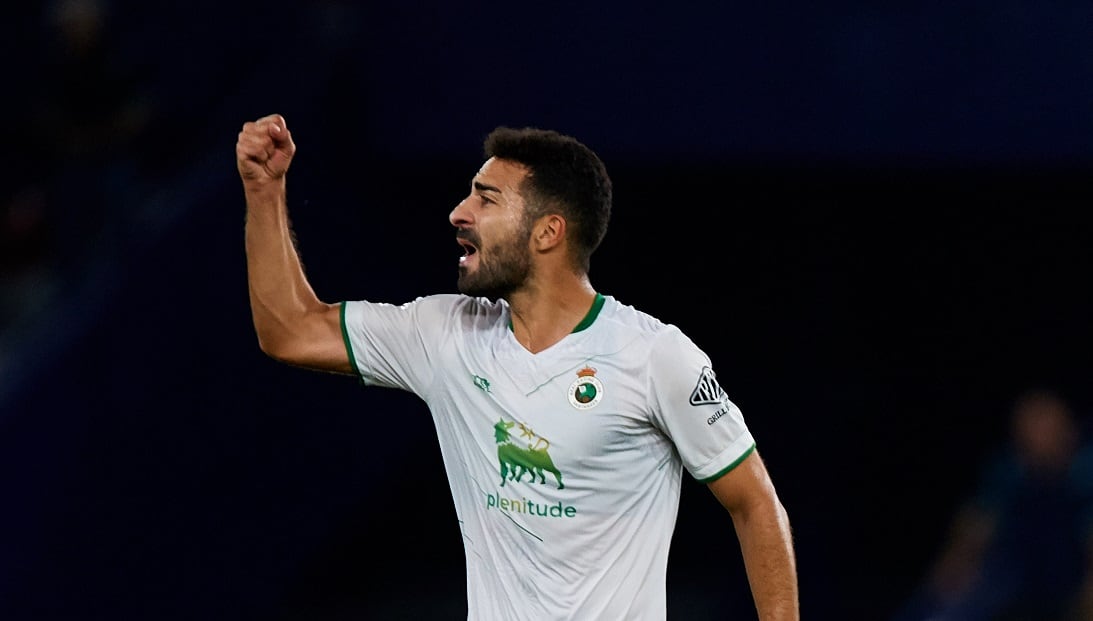 Satrustegui (C) of Real Racing Club de Santander and his teammates Ruben Alves (L) and Dani Fernandez celebrate the victory following the LaLiga SmartBank match between Levante UD and Real Racing Club de Santander at Estadi Ciutat de Valencia, October 9, 2022, Valencia, Spain. (Photo by David Aliaga/NurPhoto via Getty Images)