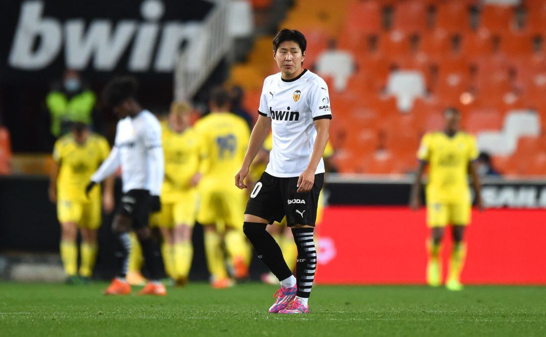 VALENCIA, SPAIN - JANUARY 04: Lee Kang-In of Valencia reacts to Cadiz CF scoring their first goal during the La Liga Santader match between Valencia CF and Cadiz CF at Estadio Mestalla on January 04, 2021 in Valencia, Spain. The match will be played without fans, behind closed doors as a Covid-19 precaution.