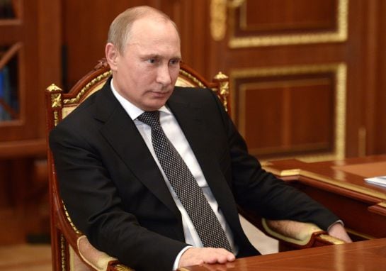 Russian President Vladimir Putin listens during a meeting in Moscow&#039;s Kremlin, Russia on Tuesday, Dec. 16, 2014. The surprise Central Bank decision to raise the rate to 17 percent from 10.5 percent came in the early hours on Tuesday in a desperate attempt