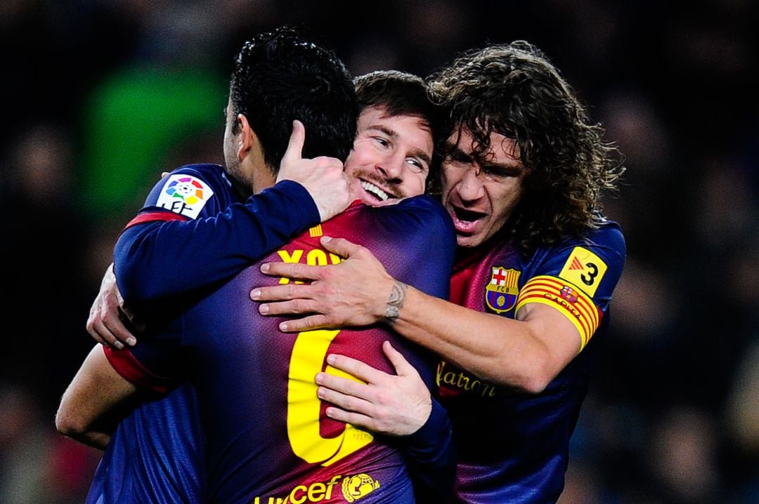 Xavi, Messi y Puyol, en un partido del FC Barcelona.