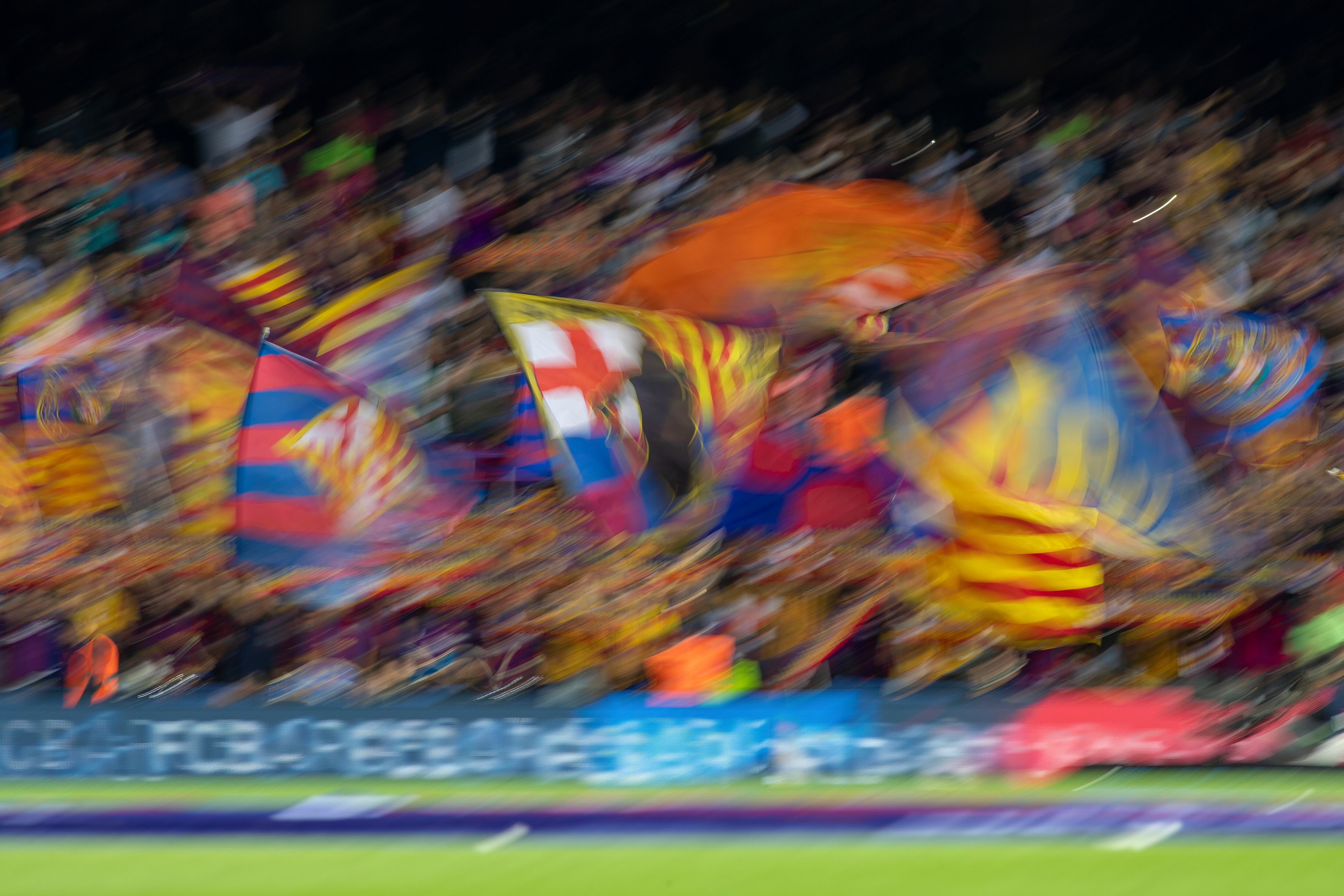 BARCELONA, SPAIN - October 6: Barcelona fans in full voice and waving flags during the Barcelona V Sevilla, La Liga regular season match at Estadio Camp Nou on October 6th 2019 in Barcelona, Spain. (Photo by Tim Clayton/Corbis via Getty Images)