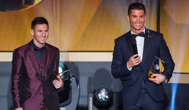 ZURICH, SWITZERLAND - JANUARY 12: FIFA Ballon d&#039;Or nominees Lionel Messi of Argentina and FC Barcelona  (L) and Cristiano Ronaldo of Portugal and Real Madrid smile during the FIFA Ballon d&#039;Or Gala 2014 at the Kongresshaus on January 12, 2015 in Zurich, Sw