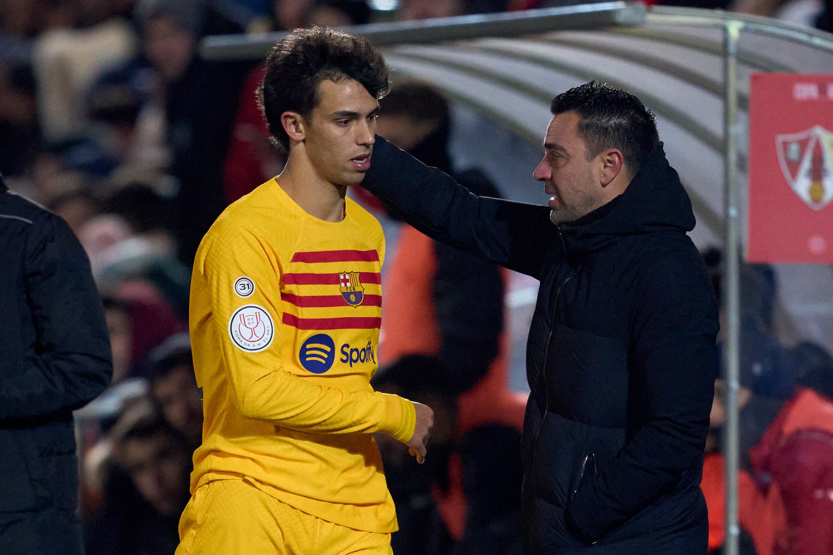 BARBASTRO, SPAIN - JANUARY 07: Joao Felix of FC Barcelona interacts with Head Coach Xavi Hernandez after being substituted during the Copa del Rey Round of 32 match between UD Barbastro and FC Barcelona at Campo Municipal de Deportes on January 07, 2024 in Barbastro, Spain. (Photo by Alex Caparros/Getty Images)