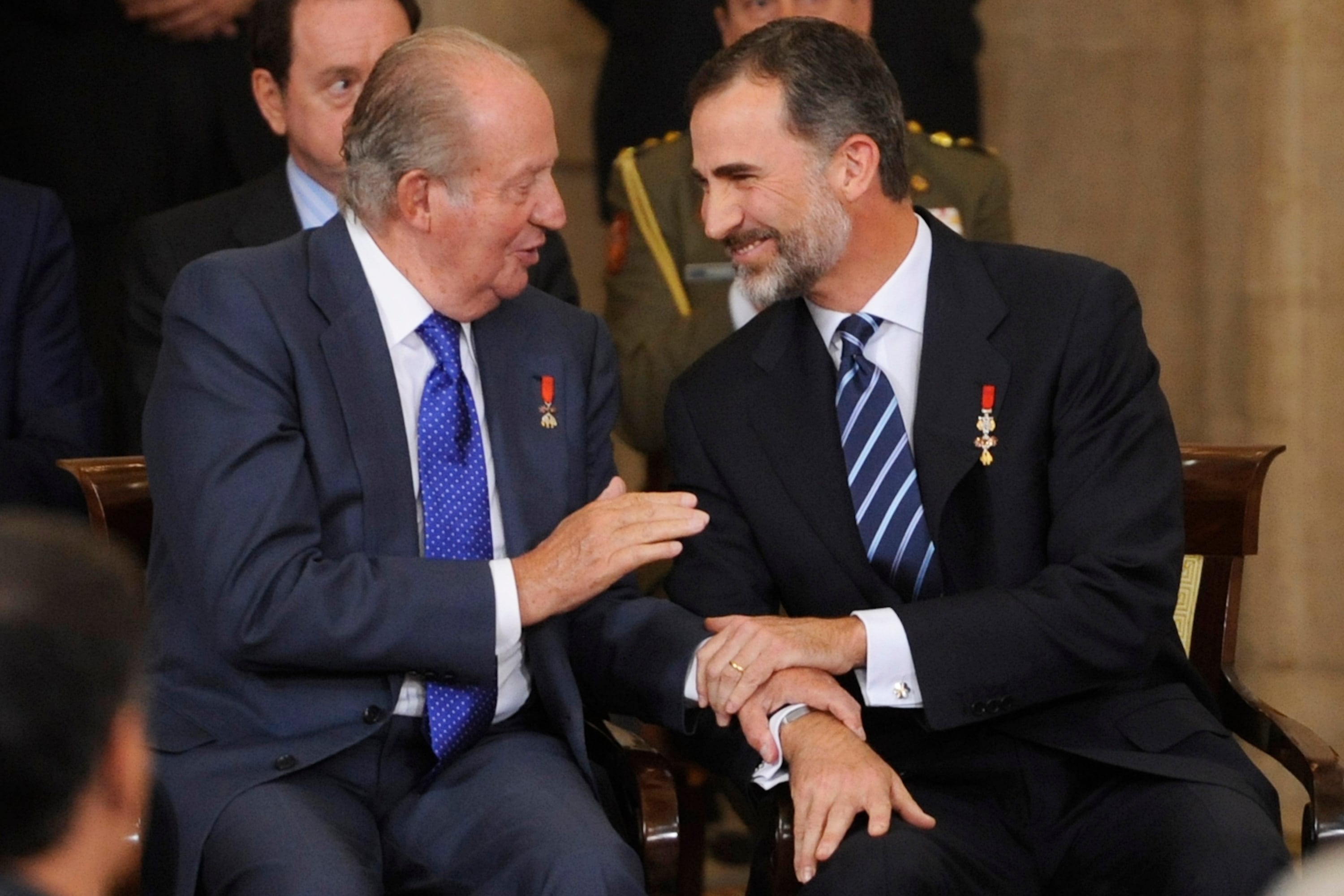 Juan Carlos I junto a su hijo Felipe VI.