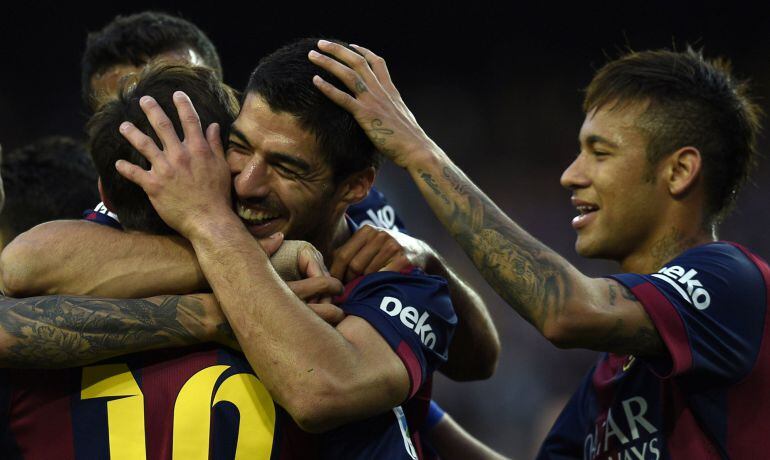 Barcelona&#039;s Uruguayan forward Luis Suarez (C), Barcelona&#039;s Brazilian forward Neymar da Silva Santos Junior (R) and Barcelona&#039;s Argentinian forward Lionel Messi (L) celebrate after scoring a goal during the Spanish league football match FC Barcelona vs Get