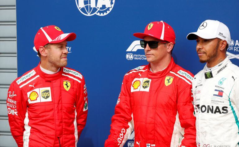 Circuit of Monza, Monza, Italy - September 1, 2018  Ferrari&#039;s Sebastian Vettel, Ferrari&#039;s Kimi Raikkonen and Mercedes&#039; Lewis Hamilton after qualifying 