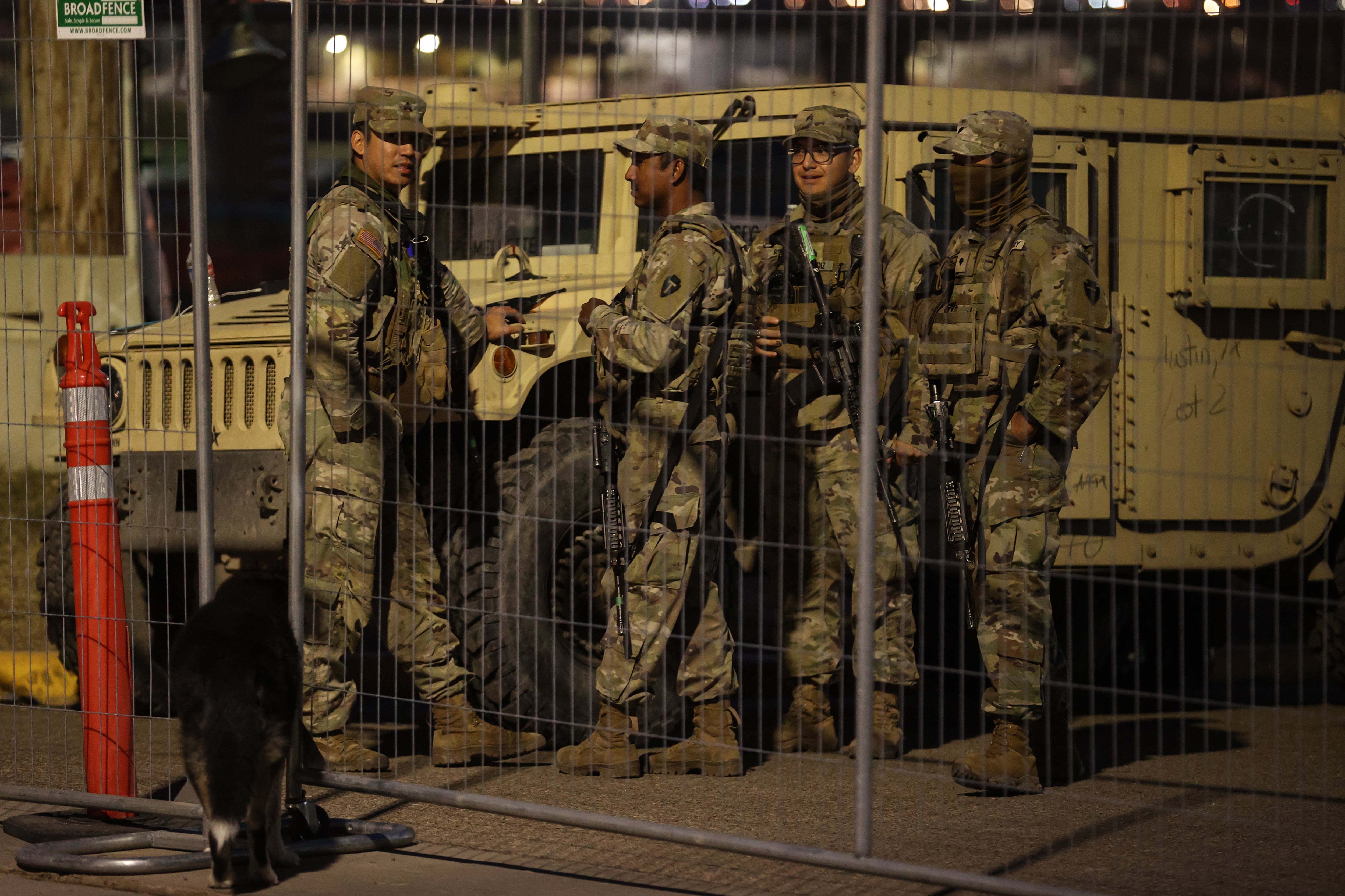 National Guard soldiers wait nearby the boat ramp where law enforcement enter the Rio Grande at Shelby Park on January 27, 2024 in Eagle Pass, Texas, United States.