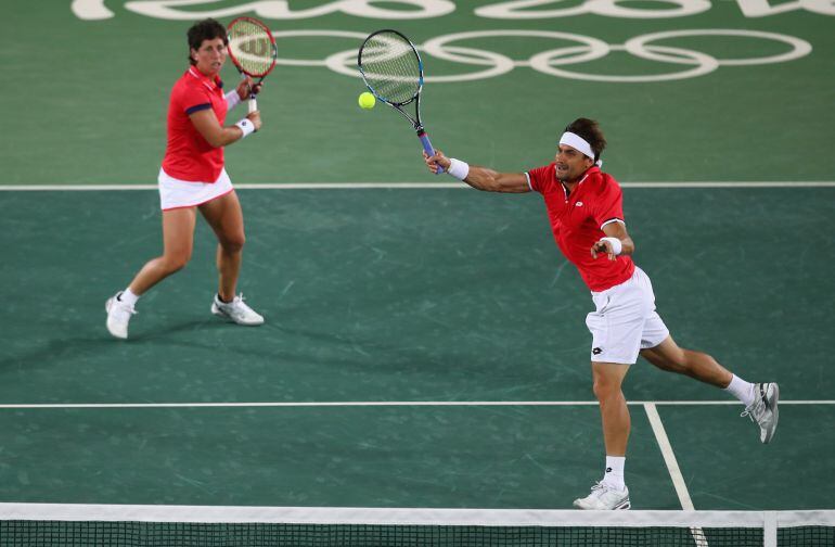 David Ferrer y Carla Suárez durante su partido en el dobes mixtos 