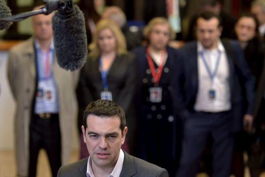 Greek Prime Minister Alexis Tsipras gives a statement after a European Union leaders summit in Brussels, early March 20, 2015. Tsipras said on Friday he was more optimistic after three hours of talks with leaders of Germany, France and European Union inst