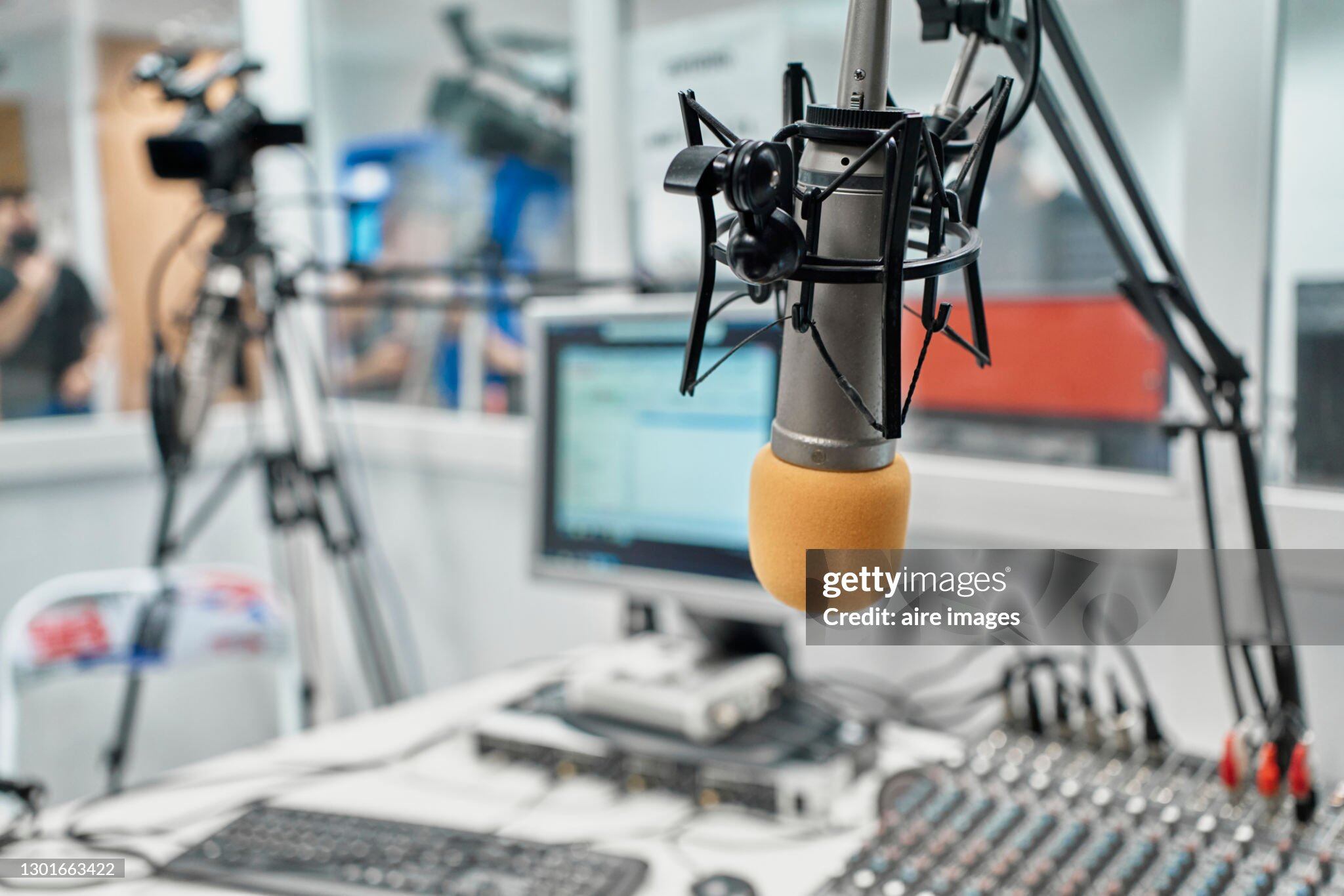 Close-up of a radio station microphone in recording studio or broadcast room.