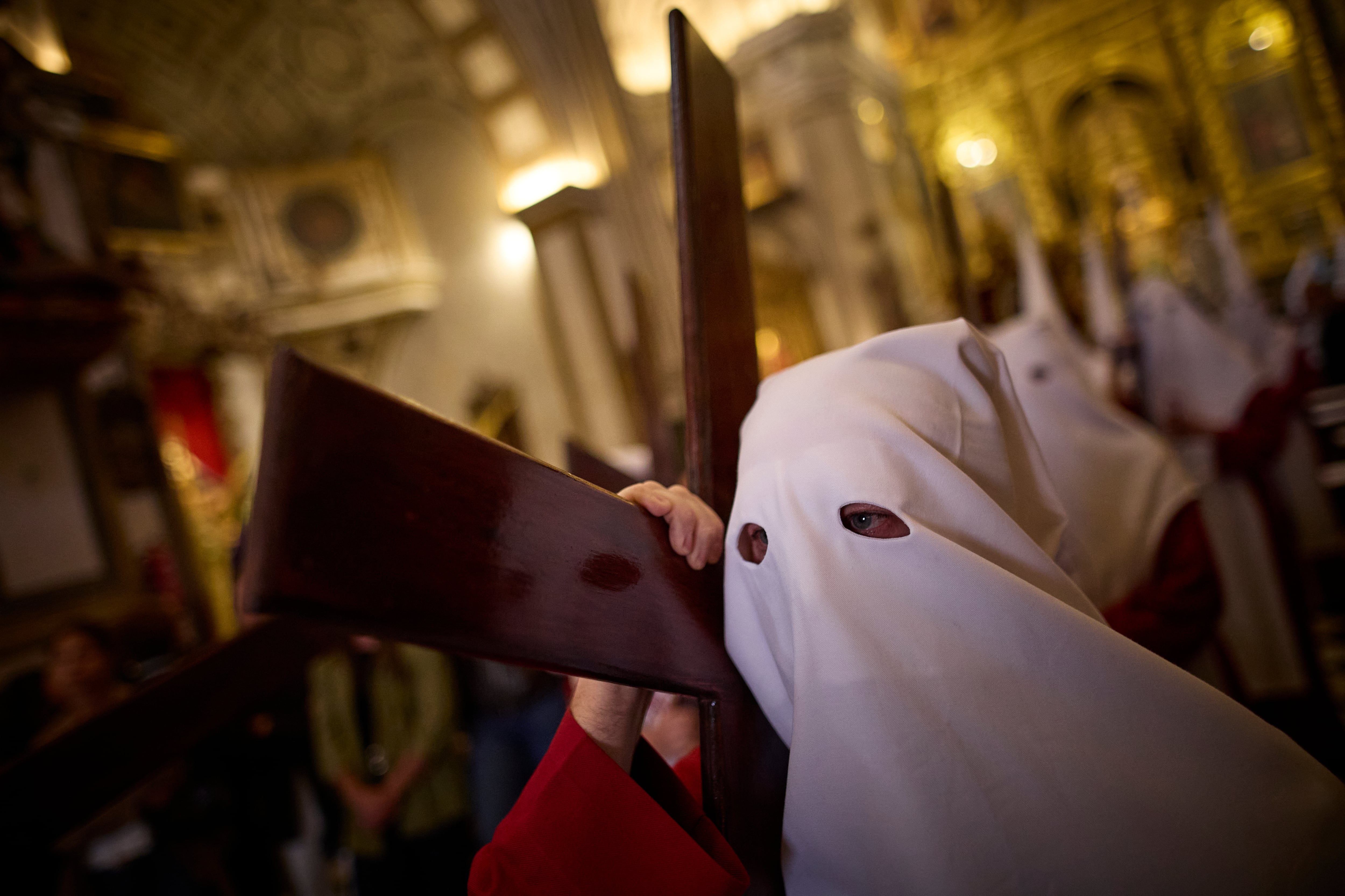 People participate in a procession during Holy Wednesday of Holy Week on April 1, 2026, in Granada, Spain. During Holy Week, prior to Easter, towns and cities in Spain, especially in Andalusia, feature Catholic groups taking to the streets in processions to commemorate the crucifixion and resurrection of Jesus Christ. (Photo by Fermin Rodriguez/NurPhoto via Getty Images)