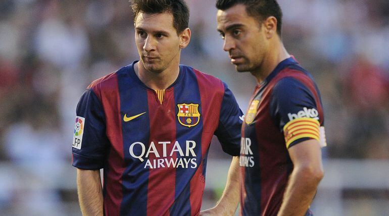 Leo Messi y Xavi Hernández.