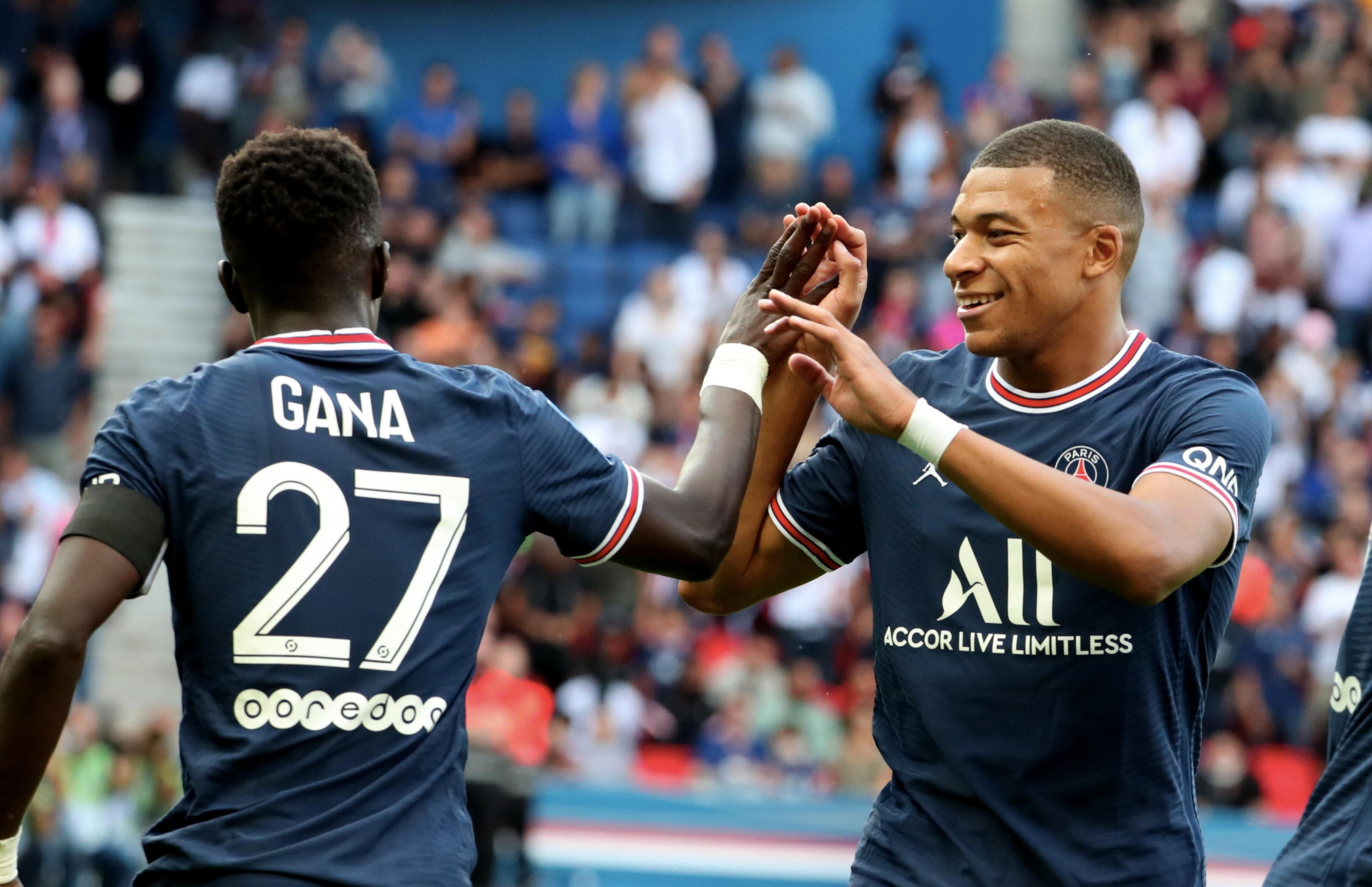 PARIS, FRANCE - SEPTEMBER 11: Idrissa Gueye of Paris Saint-Germain celebrate his goal with Kylian Mbappe during the Ligue 1 Uber Eats match between Paris Saint Germain and Clermont at Parc des Princes on September 11, 2021 in Paris, France. (Photo by Xavier Laine/Getty Images)