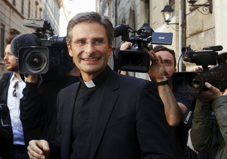 Monsignor Krzystof Charamsa smiles as he leaves at the end of his news conference in downtown Rome October 3, 2015. The Vatican dismissed Monsignor Charamsa from his post in a Holy See office on Saturday after he told a newspaper he was gay and urged the 