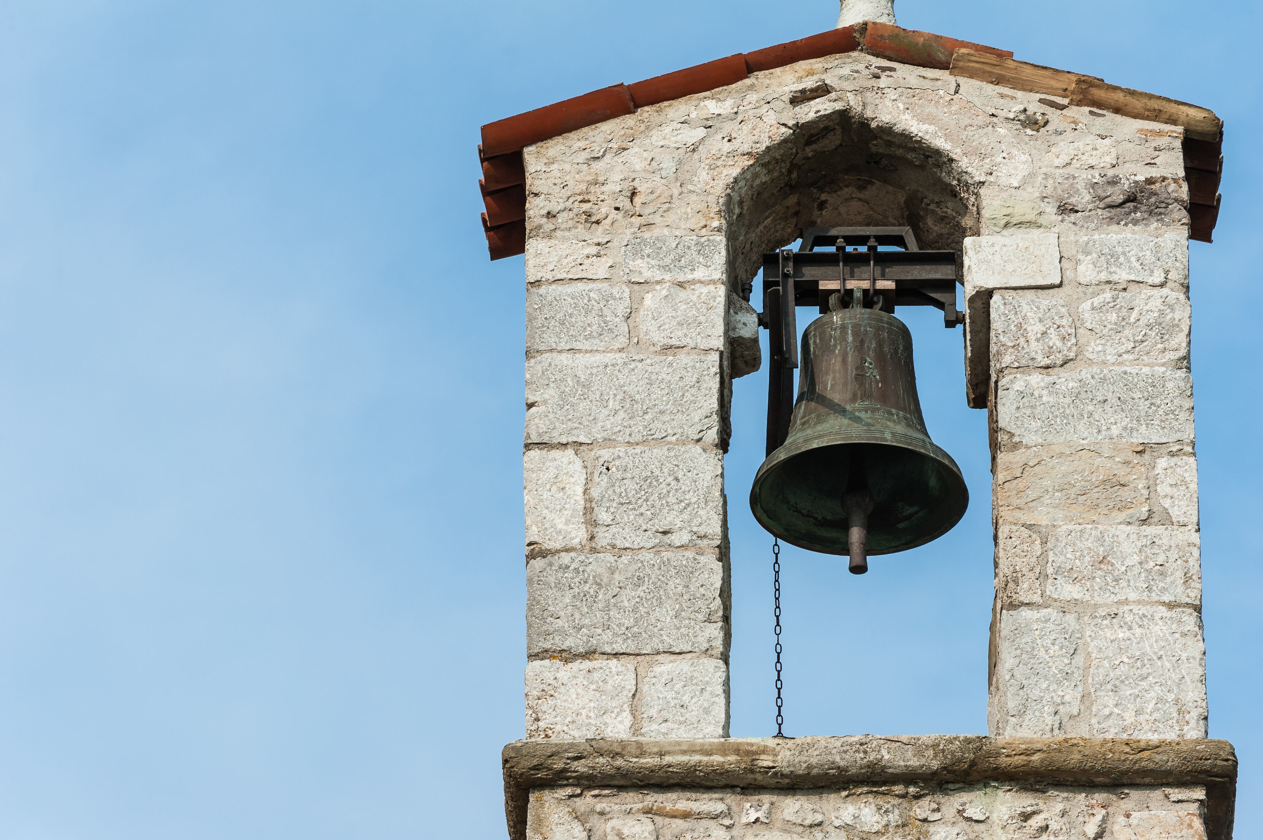 Small bell tower with a bell of a country church in the 13th century