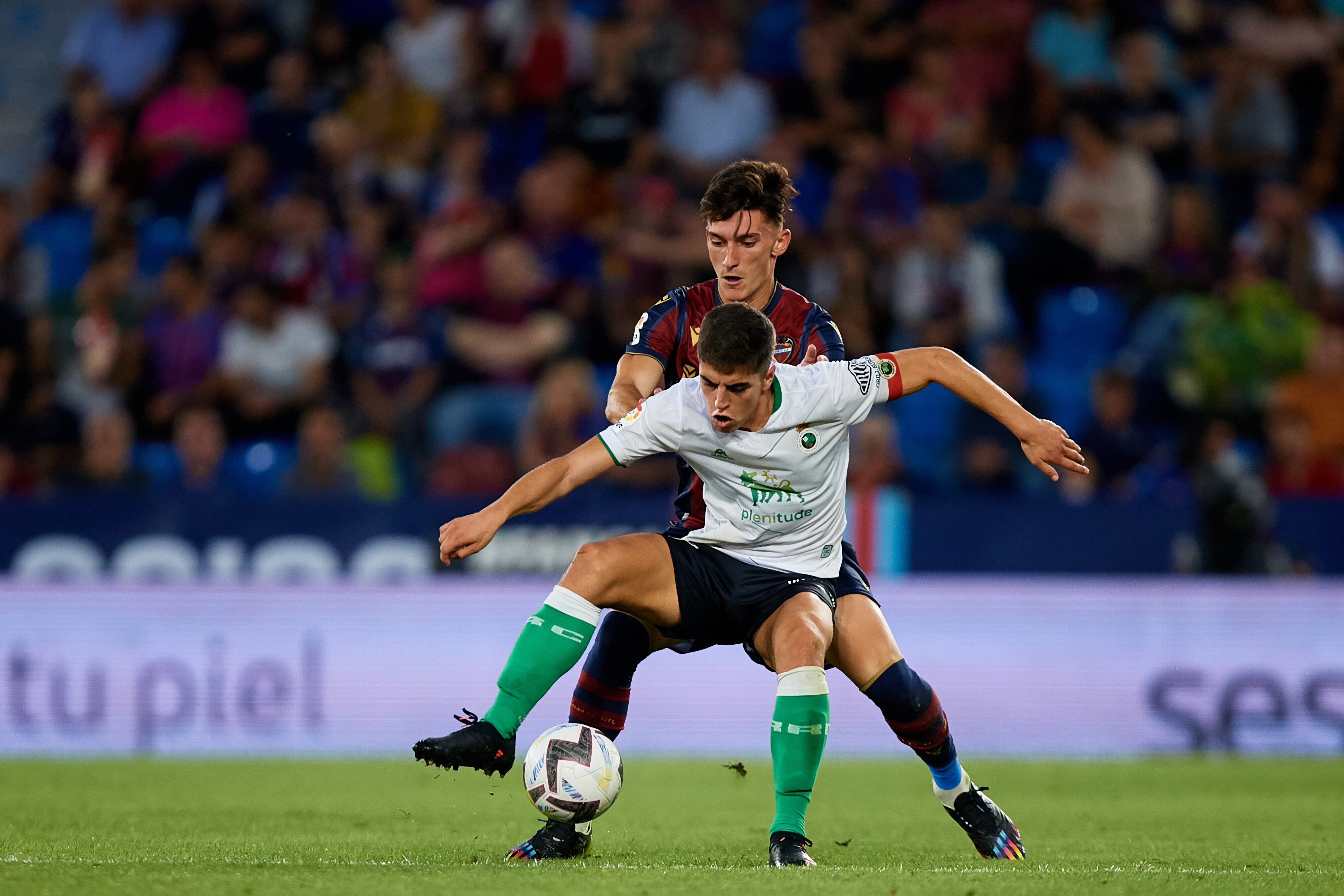 Iigo (L) of Real Racing Club de Santander competes for the ball with Pepelu of Levante UD during the LaLiga SmartBank match between Levante UD and Real Racing Club de Santander (Photo by David Aliaga/NurPhoto via Getty Images)