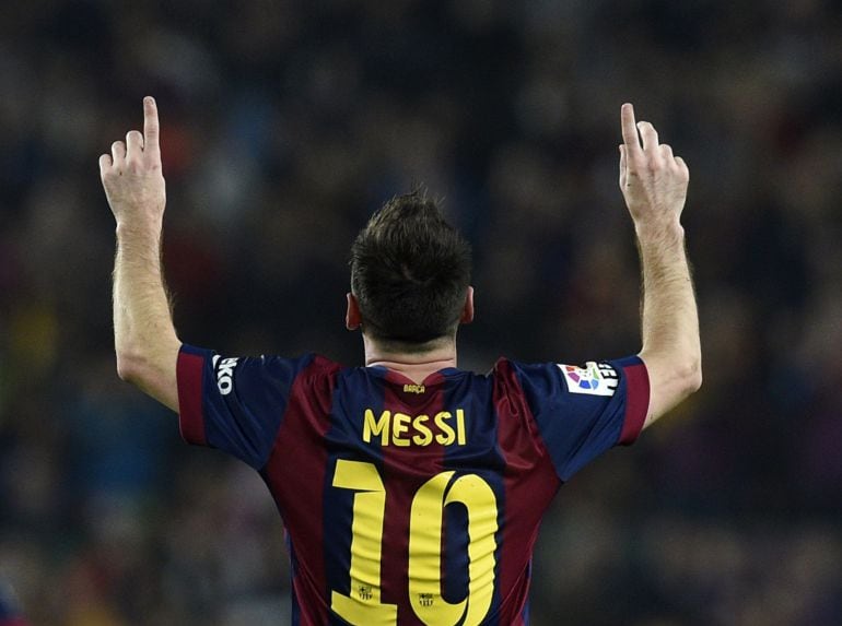 TOPSHOTS Barcelona&#039;s Argentinian forward Lionel Messi celebrates after scoring his 251st La Liga goal during the Spanish league football match FC Barcelona vs Sevilla FC at the Camp Nou stadium in Barcelona on November 22, 2014. Lionel Messi matched a 59