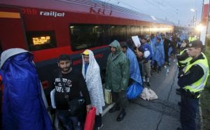 Migrants arrive at the Austrian train station of Nickelsdorf to board trains to Germany, September 5, 2015. Hundreds of exhausted migrants streamed into Austria on Saturday, reaching the border on buses provided by an overwhelmed Hungarian government that