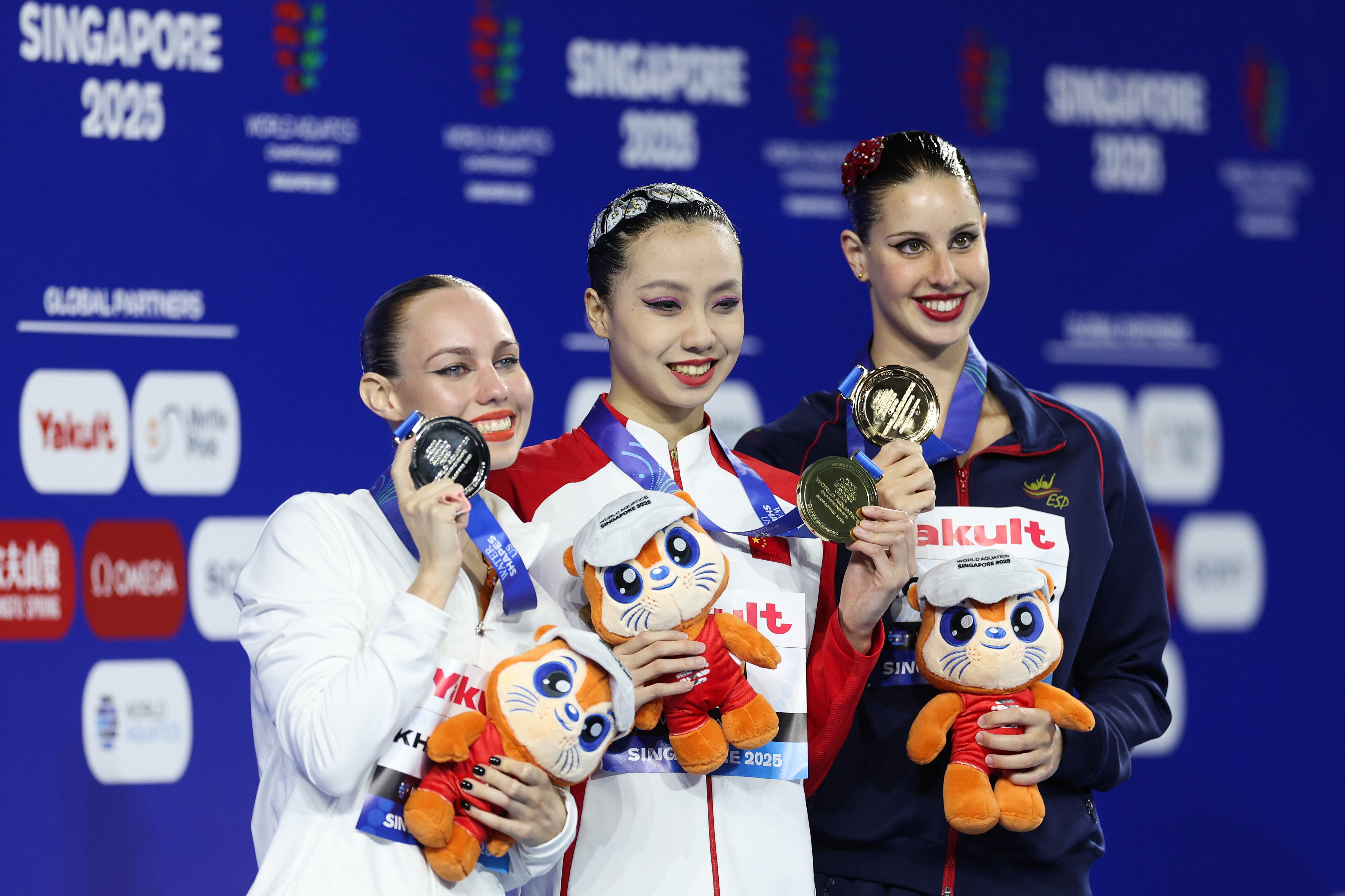 SINGAPORE, SINGAPORE - JULY 19: Gold medalist Huiyan Xu of Team China (C), silver medalist Vasilina Khandoshka (L) and bronze medalist Iris Tio Casas of Team Spain (R) pose on the podium during the Women's Solo Technical Final medal ceremony on day nine of the Singapore 2025 World Aquatics Championships at World Aquatics Championships Arena on July 19, 2025 in Singapore. (Photo by Maddie Meyer/Getty Images)