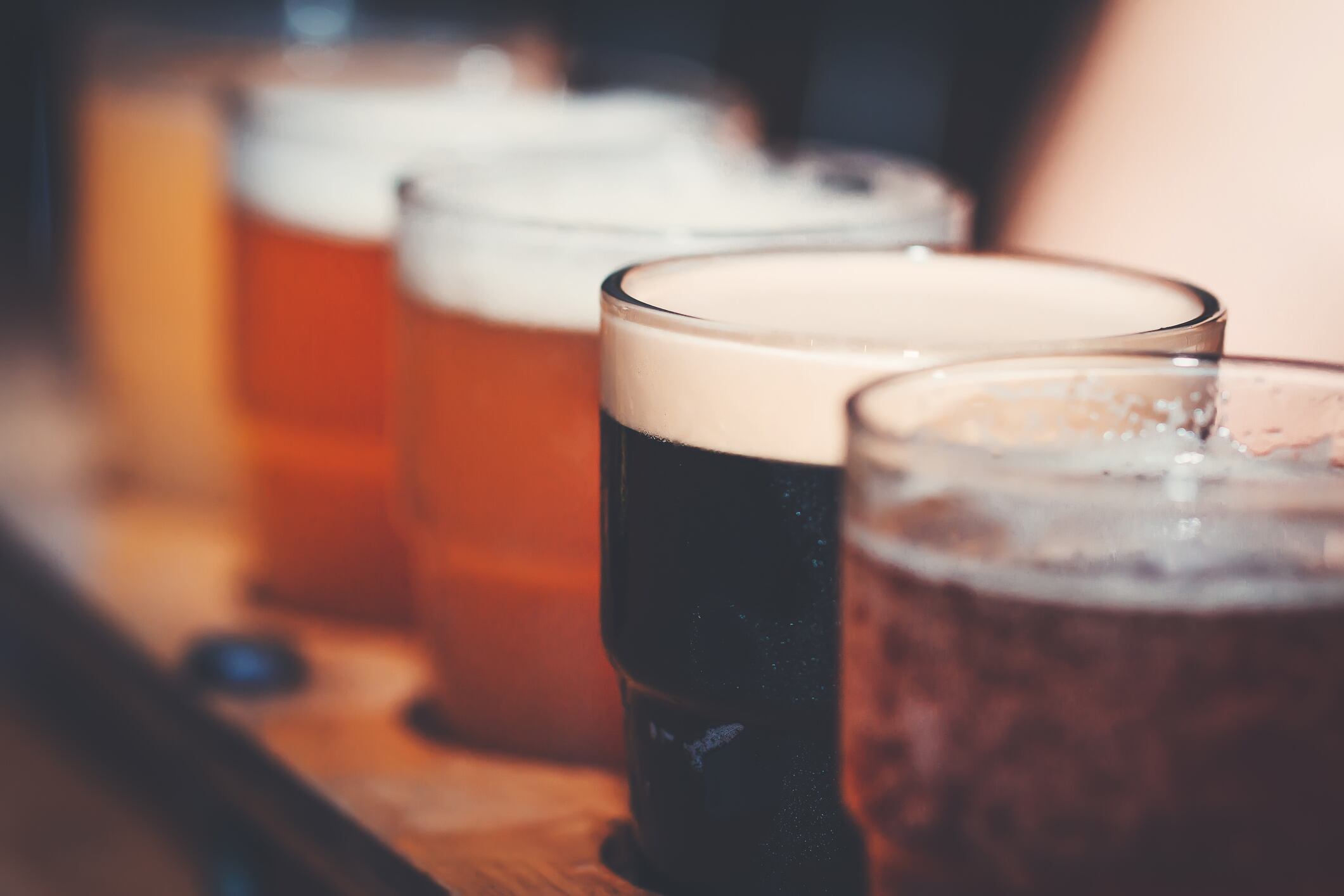 A close-up of various types of beer samplers in a raw