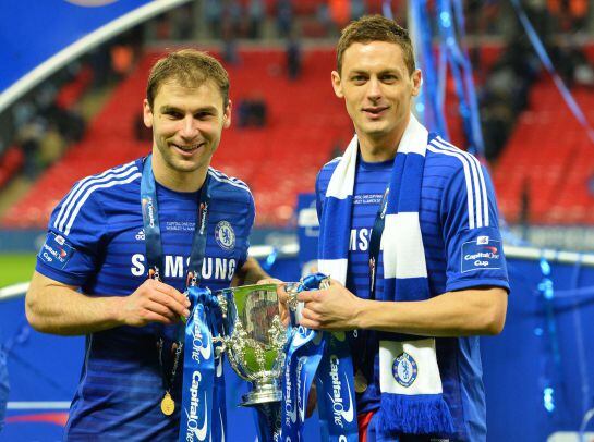 Chelsea&#039;s Serbian defender Branislav Ivanovic (L) and Chelsea&#039;s Serbian midfielder Nemanja Matic celebrate with the trophy during the presentation after Chelsea won the League Cup final football match against Tottenham Hotspur at Wembley Stadium in London