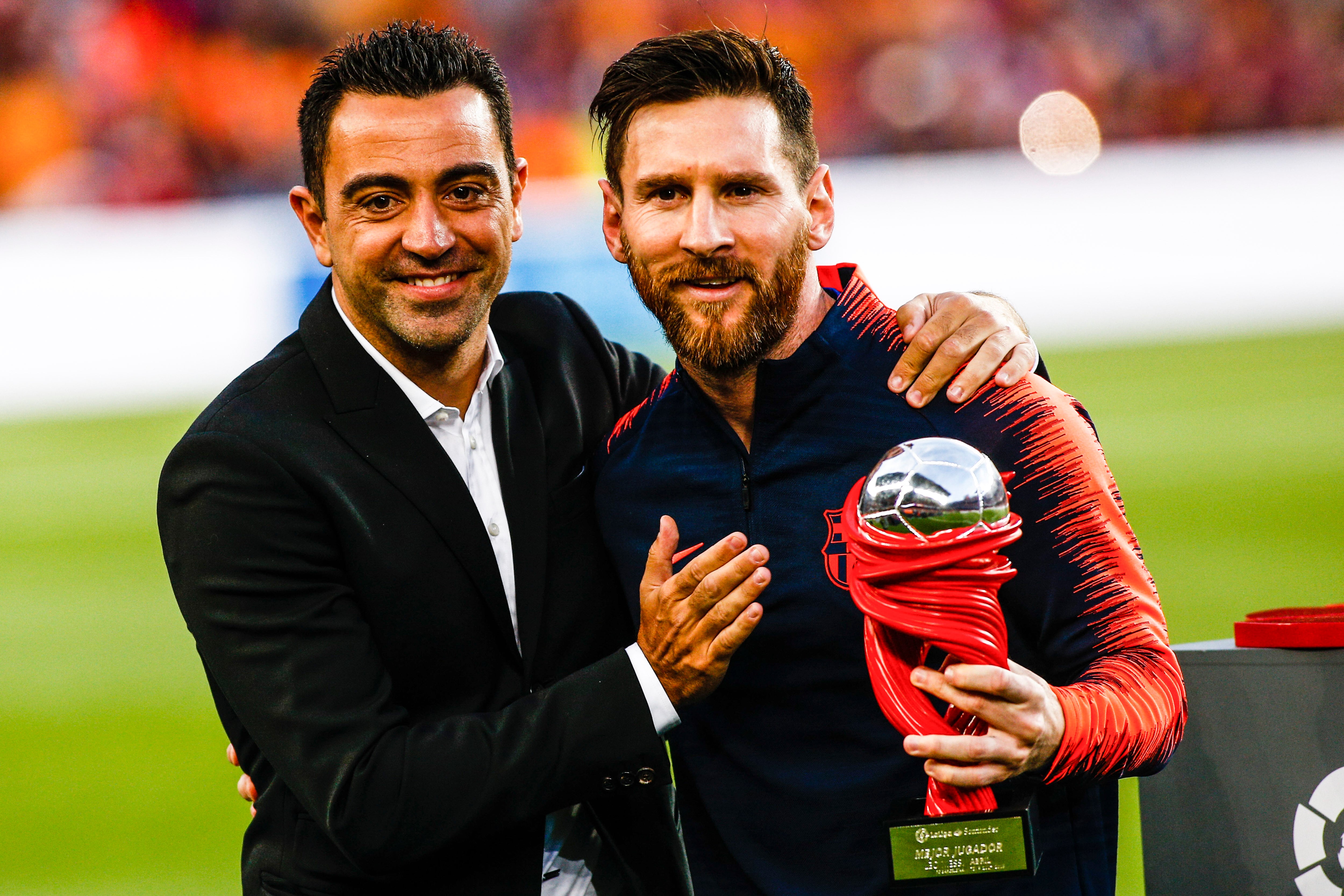 Xavi Hernández y Leo Messi, durante un partido del Barça en 2019