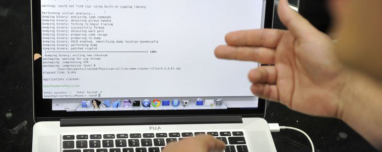 In this Wednesday, Aug. 6, 2014, photo, Joe Abbey, Arxan Technologies&#039; director of software engineering, displays on his computer how he hacked into a phone app during a demonstration at the Black Hat USA 2014 cyber security conference, in Las Vegas. Fede