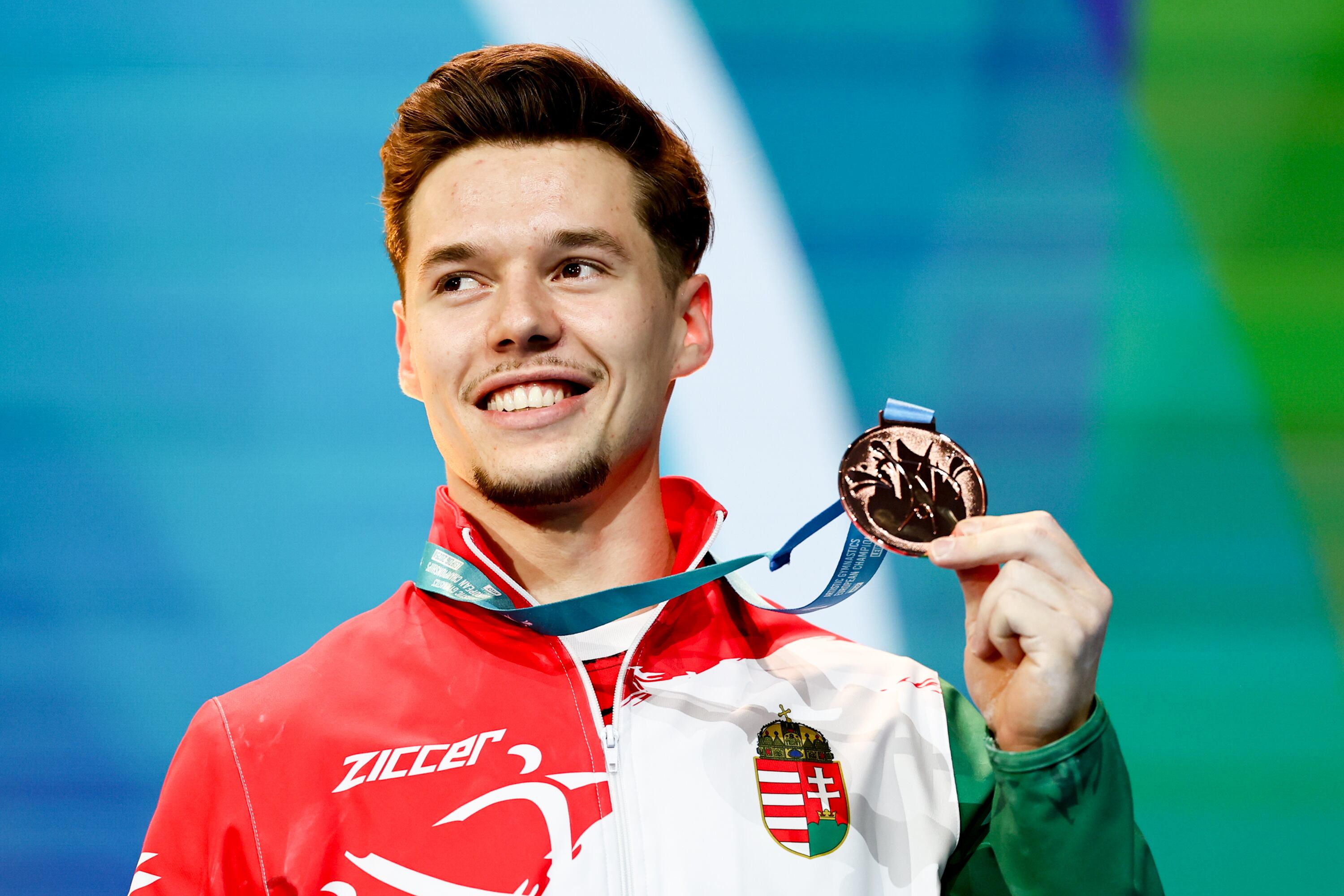 Leipzig (Germany), 29/05/2025.- Hungary's Krisztofer Meszaros celebrates winning the bronze medal of the men's All round final competition at the European Artistic Gymnastic Championships in Leipzig, Germany, 29 May 2025. (Alemania, Hungría) EFE/EPA/FILIP SINGER
