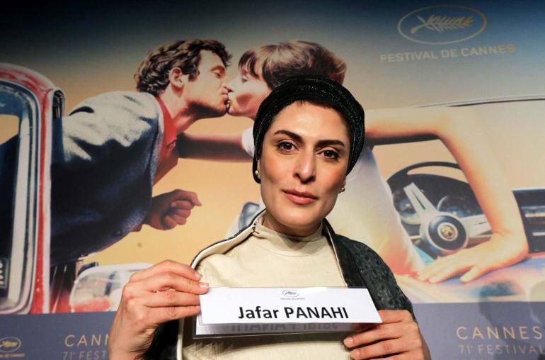 News conference for the film &quot;Three Faces&quot; in competition – Cannes, France May 13, 2018. Cast member Behnaz Jafari holds a card with the name of the director Jafar Panahi during a news conference