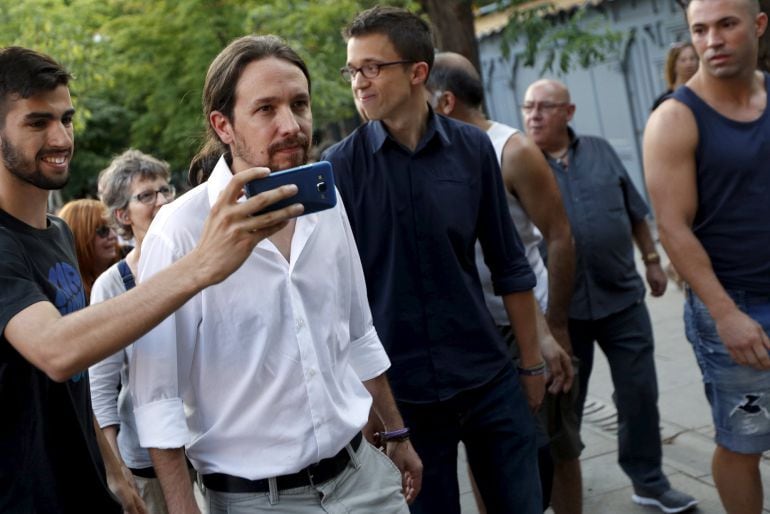 Podemos (We can) party leader Pablo Iglesias (2nd L) gets his photo taken after attending a demonstration in support of Greece, in central Madrid, Spain, June 27, 2015. The leaders of Europe and the International Monetary Fund are potentially jeopardizing