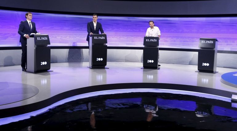 Three of the main candidates for Spain&#039;s national election (L-R) Ciudadanos party leader Albert Rivera, Socialst party (PSOE) leader Pedro Sanchez, and Podemos (We Can) party leader Pablo Iglesias, stand at their podiums next to the empty podium for Peopl