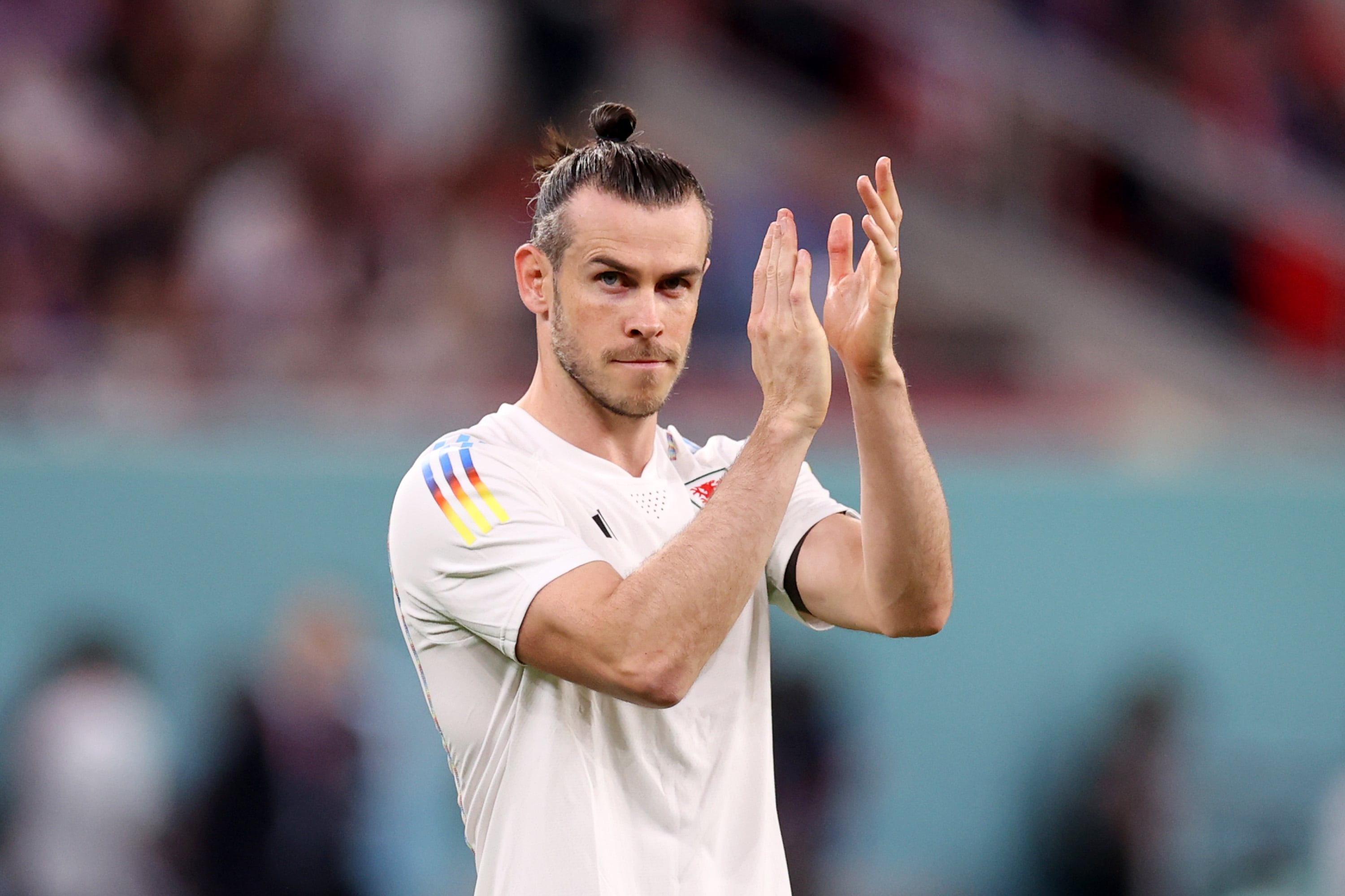 DOHA, QATAR - NOVEMBER 21: Gareth Bale of Wales applauds the fans prior to the FIFA World Cup Qatar 2022 Group B match between USA and Wales at Ahmad Bin Ali Stadium on November 21, 2022 in Doha, Qatar. (Photo by Ryan Pierse/Getty Images)