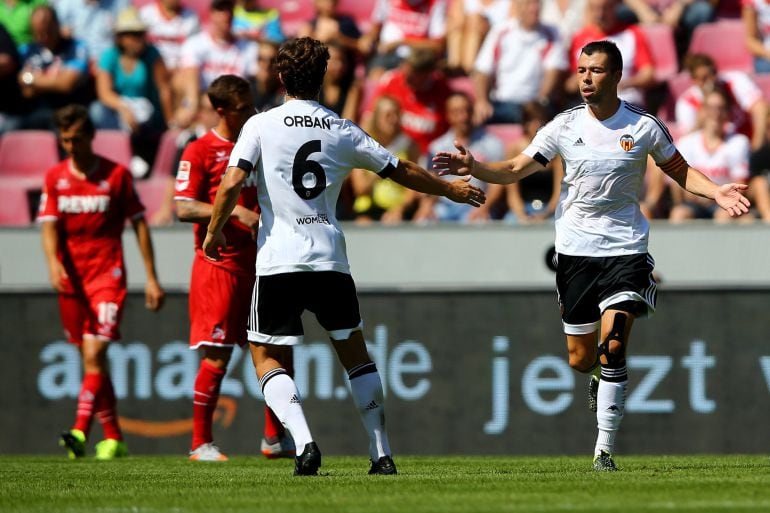 COLOGNE, GERMANY - AUGUST 02: Javi Martinez of Valencia (R) celebrates the first goal with Lucas Alegre of Valencia (L) during the Colonia Cup 2015 match between 1. FC Koeln and FC Valencia at RheinEnergieStadion on August 2, 2015 in Cologne, Germany.  (Photo by Christof Koepsel/Getty Images)