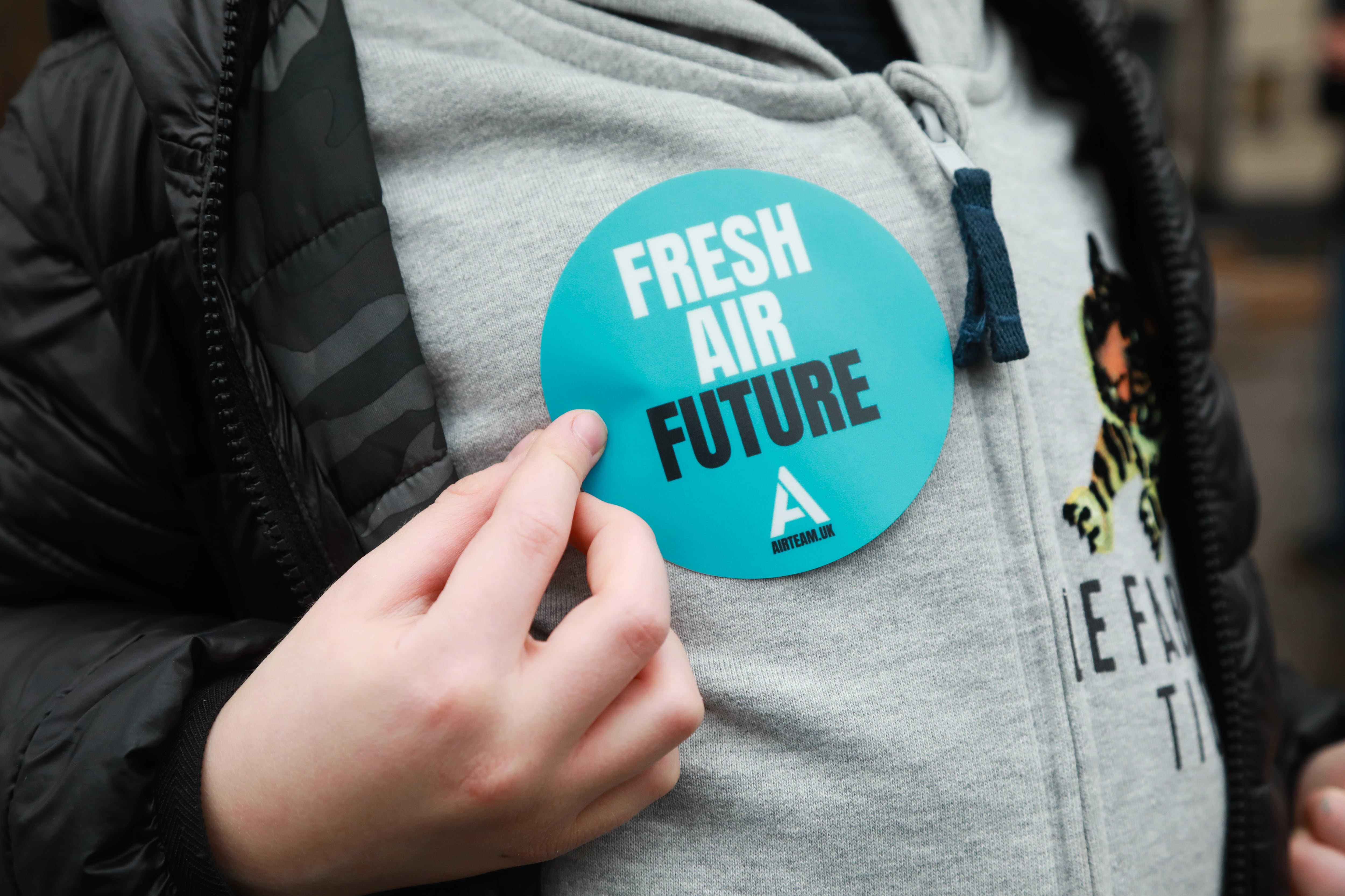 Parents and children from The Air Team, an air pollution campaign group, celebrate the arrival of Londons Ultra Low Emission Zone (ULEZ), on 8th of April 2019 in London, Unted Kingdom. The new zone is one of the most ambitious clean air schemes in the world, and is expected to reduce road transport emissions by around 45%. An arch was set up with plant pots to be handed out to passersby and commuters were encouraged to walk through the arch. (photo by Kristian Buus/In Pictures via Getty Images Images)
