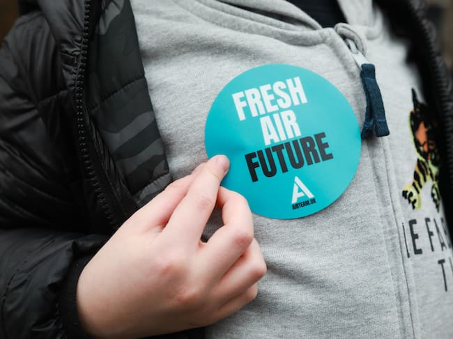 Parents and children from The Air Team, an air pollution campaign group, celebrate the arrival of Londons Ultra Low Emission Zone (ULEZ), on 8th of April 2019 in London, Unted Kingdom. The new zone is one of the most ambitious clean air schemes in the world, and is expected to reduce road transport emissions by around 45%. An arch was set up with plant pots to be handed out to passersby and commuters were encouraged to walk through the arch. (photo by Kristian Buus/In Pictures via Getty Images Images)
