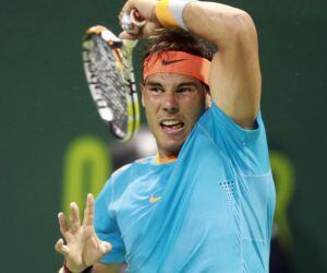 Rafael Nadal of Spain returns the ball to Michael Berrer of Germany during their match at the Qatar Open tennis tournament in Doha January 6, 2015. REUTERS/Mohammed Dabbous (QATAR - Tags: SPORT TENNIS)