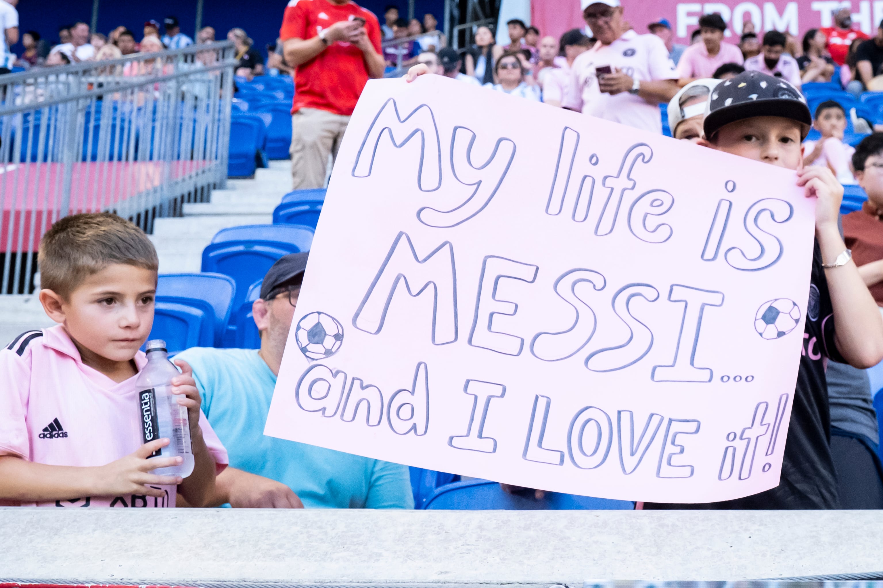 HARRISON, NEW JERSEY - AUGUST 26: A young fan hold a sign that says My Life Is Messi And I Love It in support of Lionel Messi #10 of Inter Miami at the start of the of the Major League Soccer match against the New York Red Bulls at Red Bull Arena on August 26, 2023 in Harrison, New Jersey. (Photo by Ira L. Black - Corbis/Getty Images)