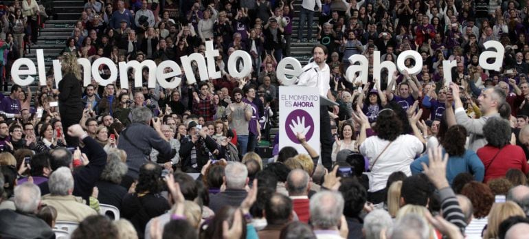 Podemos (&#039;We can&#039;) Party secretary general Pablo Iglesias delivers a speech during a party meeting in Valencia January 25, 2015. The letters read, &quot;The Moment Is Now&quot;.  REUTERS/Heino Kalis (SPAIN - Tags: POLITICS)