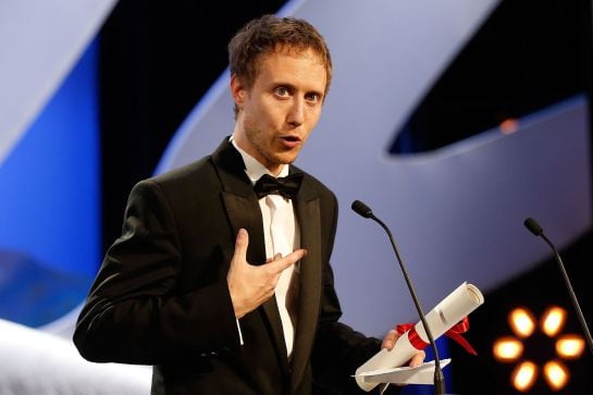 Hungarian director Laszlo Nemes talks on stage after being awarded with the Grand Jury Prize during the closing ceremony of the 68th Cannes Film Festival in Cannes, southeastern France, on May 24, 2015. AFP PHOTO / VALERY HACHE