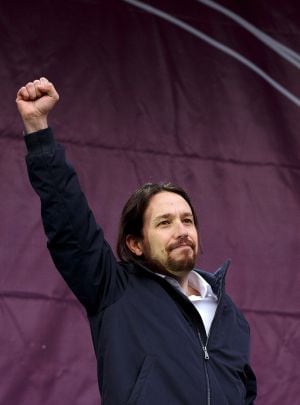 MADRID, SPAIN - JANUARY 31: Leaders of Podemos (We Can) Pablo Iglesias rises his fist on stage at the end of a march on January 31, 2015 in Madrid, Spain. According to the last opinion polls Podemos (We Can), the anti-austerity left-wing party that emerge